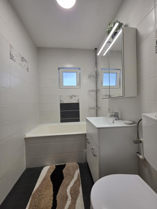 De închiriat 2 camere + loc de parcare