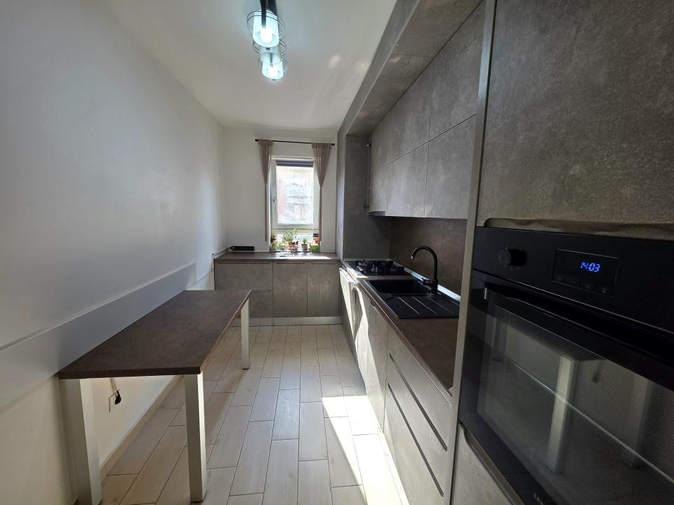 Apartament cu 2 camere cu boxa + loc de parcare 