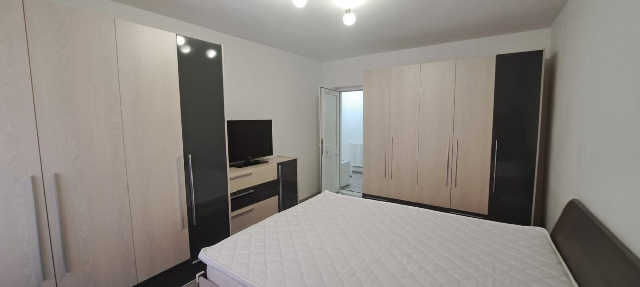 Apartament modern cu 2 camere, curte privată și 2 locuri de parcare