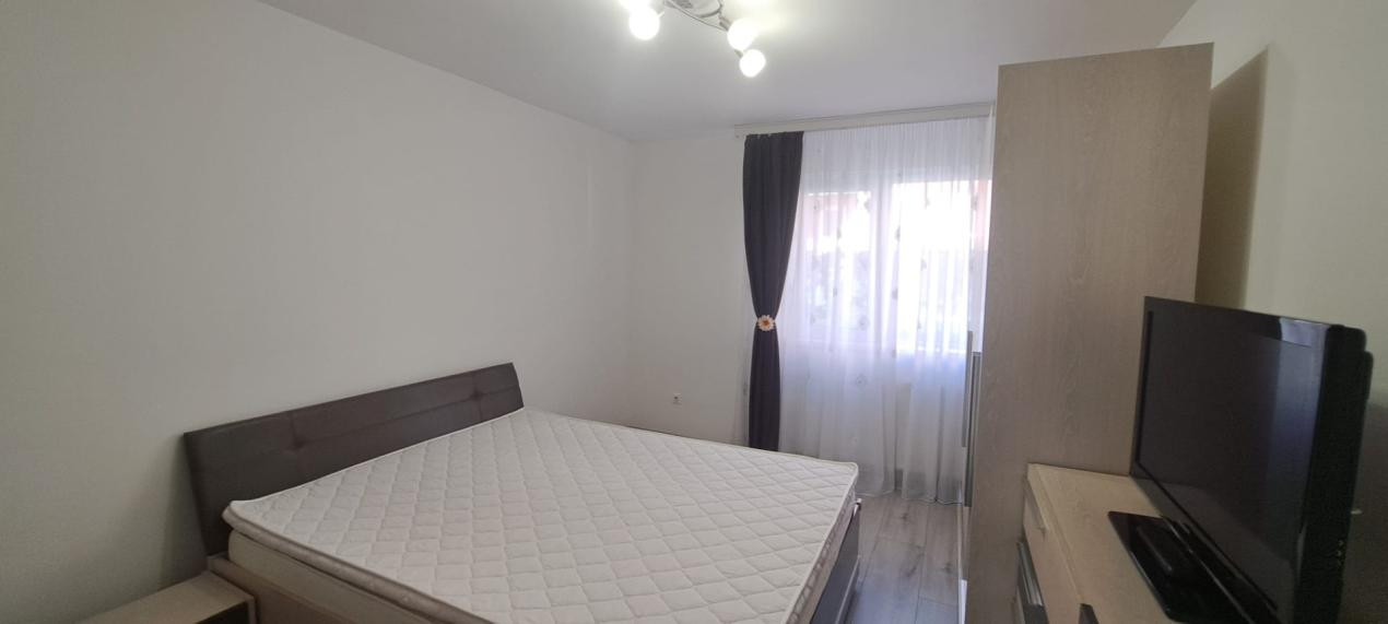 Apartament modern cu 2 camere, curte privată și 2 locuri de parcare